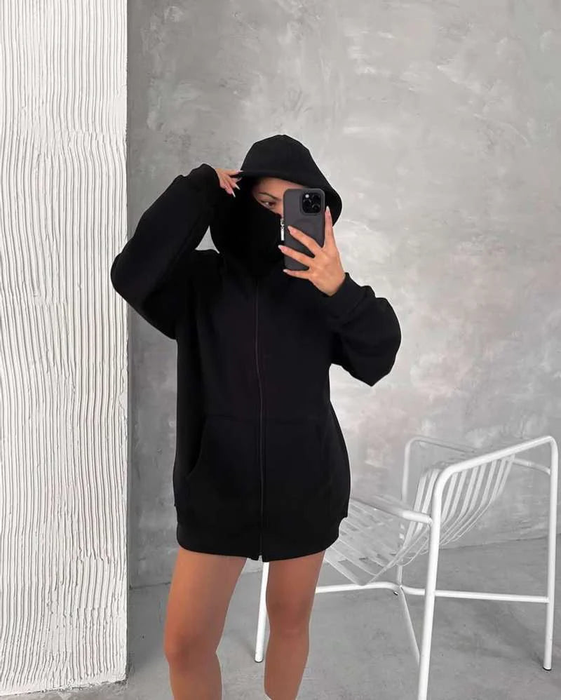 Model styling Stealth Tech shiesty hoodie in city streetwear outfit, ski mask zip-up hoodie designed for stealth, comfort, and modern drip.